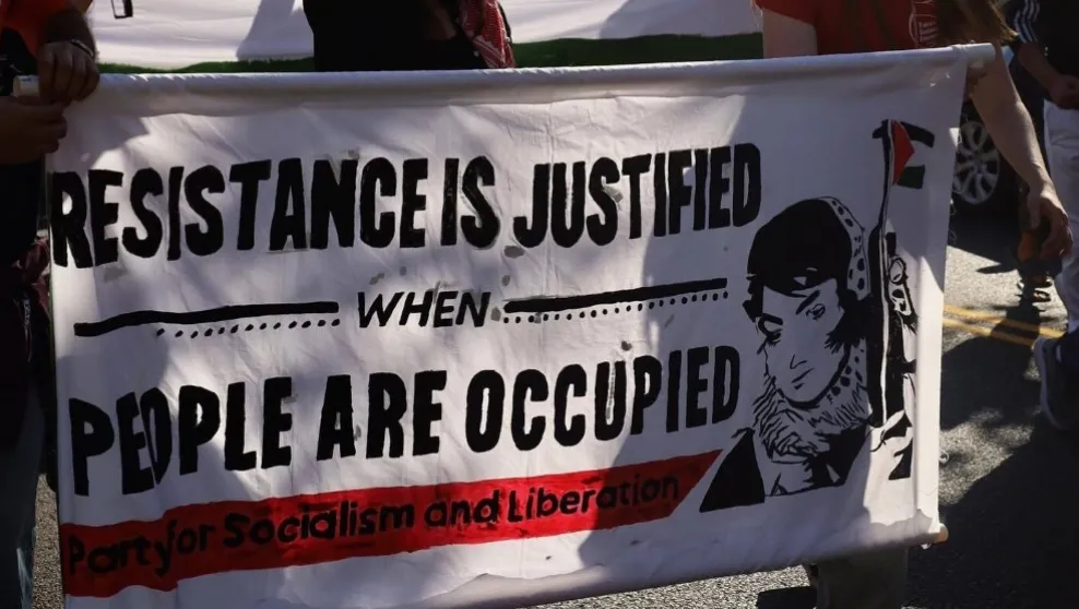 Photo: Salt Lake City, Utah -- Protesters carried a banner that reads "Resistance is justified when people are occupied" in October. The banner also depicts Leila Khaled, a leader of the Popular Front for the Liberation of Palestine, a United States-designated terrorist organization.